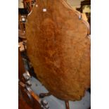 Victorian oval figured walnut tilt-top pedestal centre table with moulded top and shallow frieze