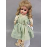 Small late 19th / early 20th Century Armand Marseille 390 bisque headed doll in green dress with