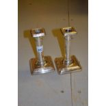 Pair of Birmingham silver dwarf candlesticks of plain design with square bases