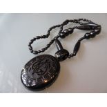 Antique Whitby jet oval locket with chain