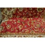 Red ground Kashan pattern machine carpet, 2.3m x 1.