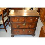 Small early 18th Century walnut chest of two short over two long drawers with brass drop handles