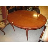 Reproduction mahogany oval extending dining table together with a set of six reproduction mahogany