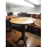 George III circular mahogany tilt-top pedestal table with a moulded top above turned column and