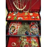 Large black jewellery box containing a quantity of various costume jewellery