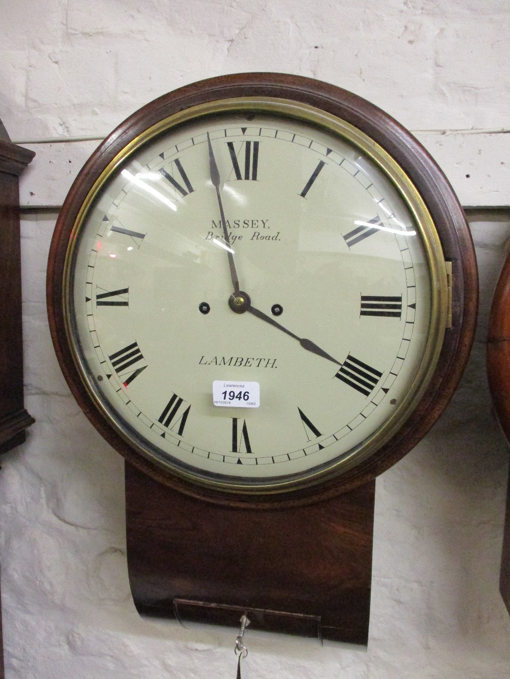 19th Century mahogany circular drop-dial wall clock, the painted dial with Roman numerals,