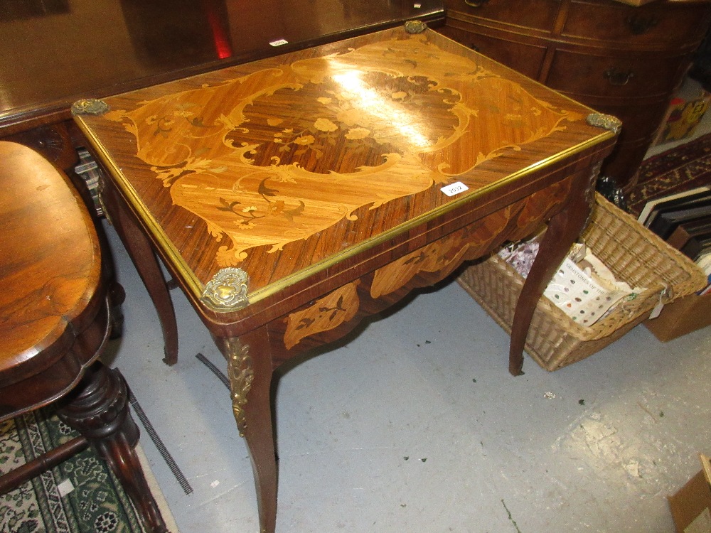 French floral and marquetry inlaid rosewood and kingwood fold-over games table with baize lined