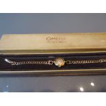 Ladies 9ct gold Omega wristwatch with a 9ct gold bracelet strap in original box CONDITION