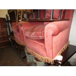 Pair of early 20th Century pink upholstered wing back armchairs