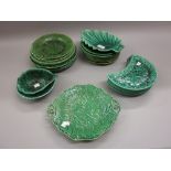 Quantity of Wedgwood and other green glazed and relief moulded plates and dishes
