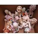 Box containing a collection of fifteen various large porcelain half dolls,