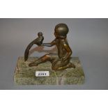 Art Deco patinated spelter figure of a girl and bird,