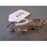 Four various dress rings including an opal and diamond ring,