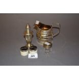 Sterling silver pepper, two silver topped rouge pots, French silver tea strainer,