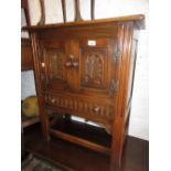 Small reproduction oak two door side cabinet with a single drawer,