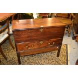 George III mahogany trunk with a hinged cover above a single drawer with brass handles and