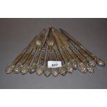 Fourteen silver handled knives and forks