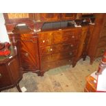 Reproduction mahogany sideboard having four central drawers flanked by two panelled doors raised on