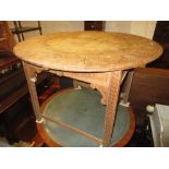 Circular carved oak table (with later inserted top) on square supports