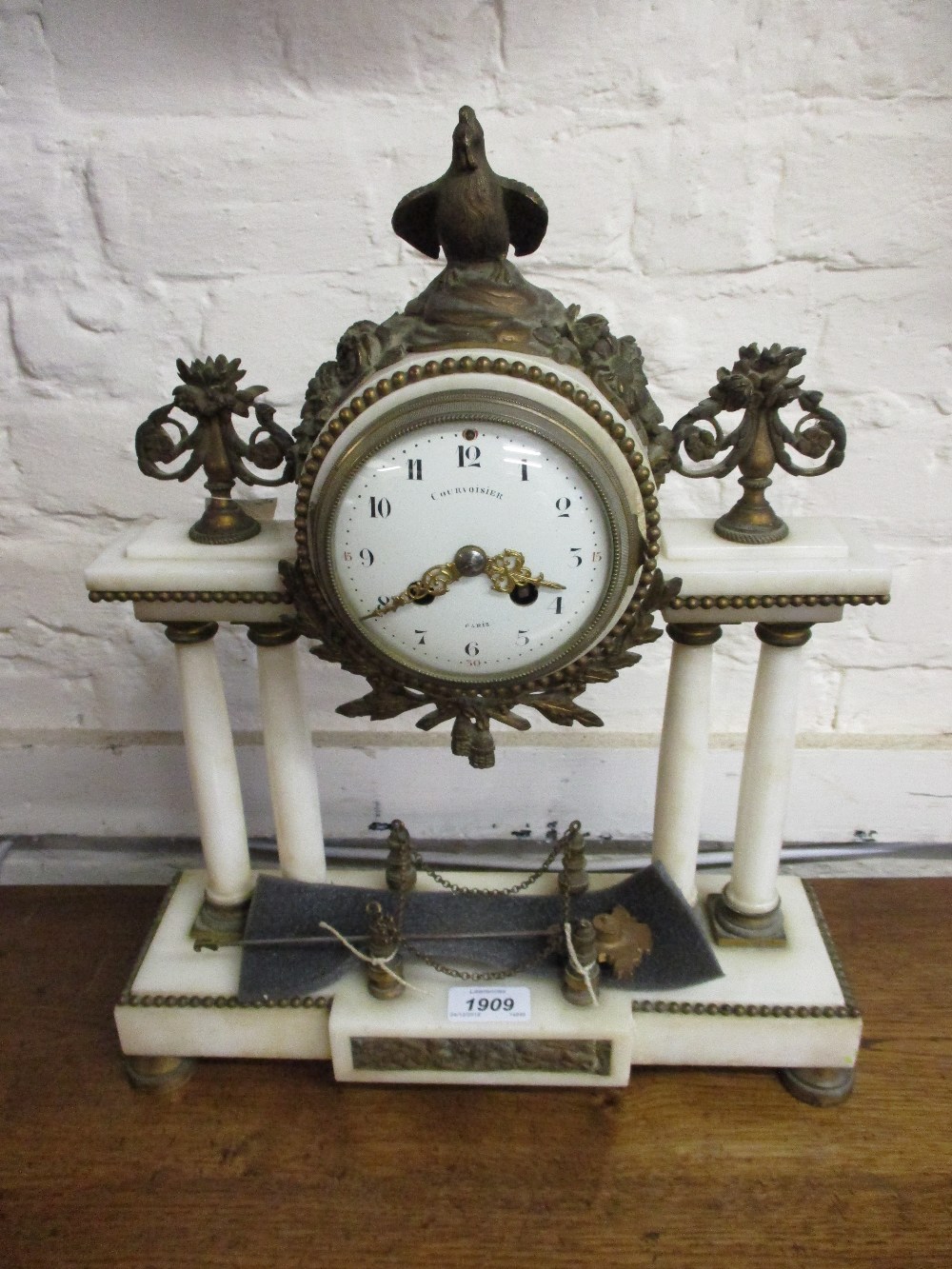 French white marble and ormolu mounted two train mantel clock, the white dial signed Courvoisier,