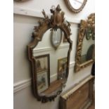 19th Century gilded composition cartouche wall mirror with shield and floral surmount (with