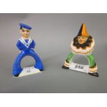 Two Carlton ware napkin rings in the form of a sailor and a clown
