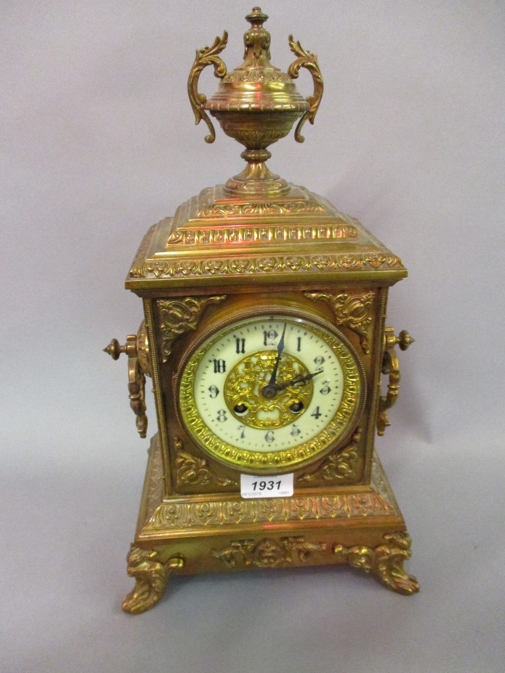 Late 19th Century gilt brass mantel clock of ornate design,