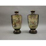 Pair of Satsuma hexagonal pottery vases painted with panels of figures and a landscape