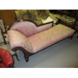 Victorian carved mahogany chaise longue with pink damask upholstery and turned front supports