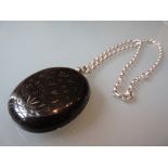 Antique Whitby jet oval locket with silver chain