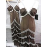 Amanda Wakeley, two brown and white bead work decorated dresses, size 12 and size 14 (unworn,