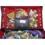 Black jewellery box containing silver and other costume jewellery