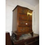 Pair of reproduction mahogany four drawer serpentine fronted bedside cabinets on bracket feet