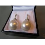 Pair of 18ct white gold pearl and round brilliant cut diamond drop earrings