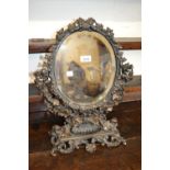 Ornate patinated metal table mirror