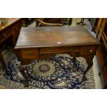 Antique walnut lowboy in 18th Century style, the moulded top above three drawers,