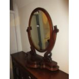 19th Century mahogany oval swing frame toilet mirror with jewel compartment having hinged cover on