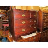 19th Century mahogany bow fronted chest with two short and two long drawers with oval brass handles