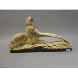Large Continental Art Deco pottery group of two pheasants