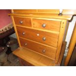 20th Century oak low chest of two short over two long drawers with silvered knob handles