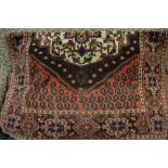 Antique Kurdish rug with a medallion and all-over Boteh design on a brick red field with repeating