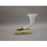 White opaque glass and brass cornucopia vase on an alabaster plinth base