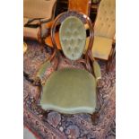 Good quality Victorian carved walnut and green button upholstered open arm spoon back chair with