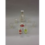 Art Deco glass liqueur decanter and four glasses together with three rectangular dishes with red