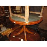 Reproduction circular leather inset yew wood pedestal table on splay supports with brass caps and