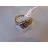 14ct Yellow gold crossover design dress ring set multiple small diamonds flanking a central garnet