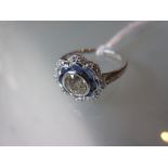 18ct White gold sapphire and diamond daisy ring, the central diamond approximately 0.