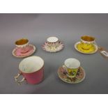 Pair of Royal Worcester porcelain miniature cups and saucers decorated in pink and yellow,