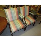 Pair of reproduction mahogany and upholstered open elbow chairs