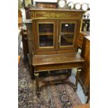 19th Century French mahogany brass inlaid bonheur du jour with a galleried top above two glazed